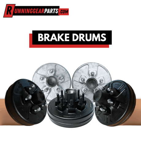 Brake drums with hubs, black and silver metal construction and molded mounting studs.